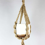 empty white pot in spiral macramé hanger